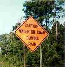 Caution Water on Road
